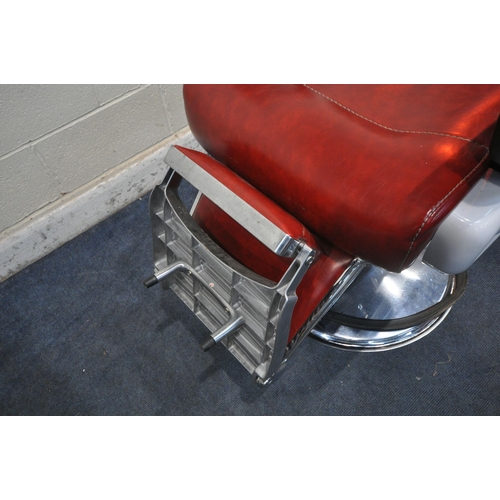 1268 - A PAIR OF RETRO BARBERS CHAIRS, with red leatherette upholstery, on a chrome base height adjustable ... 