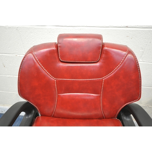 1268 - A PAIR OF RETRO BARBERS CHAIRS, with red leatherette upholstery, on a chrome base height adjustable ... 