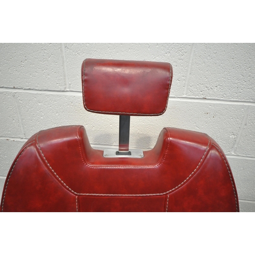 1268 - A PAIR OF RETRO BARBERS CHAIRS, with red leatherette upholstery, on a chrome base height adjustable ... 