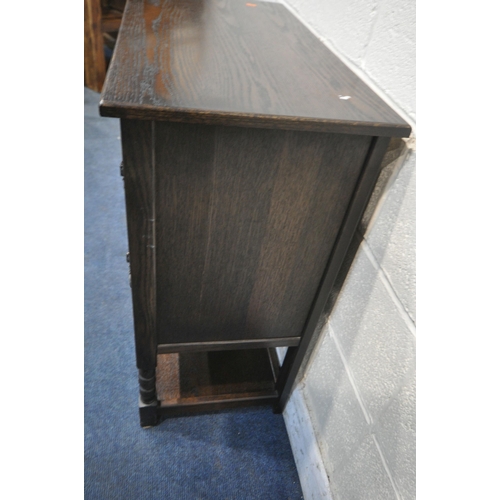 1278 - A JAYCEE OAK CABINET, with two linenfold doors, above a single drawer, on turned front legs, united ... 