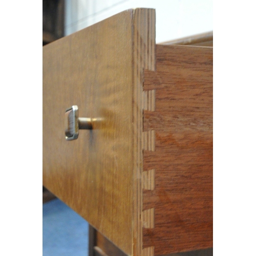 1281 - A MID CENTURY TEAK DRESSING TABLE, with a single rectangular mirror, above four drawers, on tapered ... 