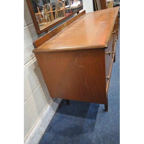 1281 - A MID CENTURY TEAK DRESSING TABLE, with a single rectangular mirror, above four drawers, on tapered ... 