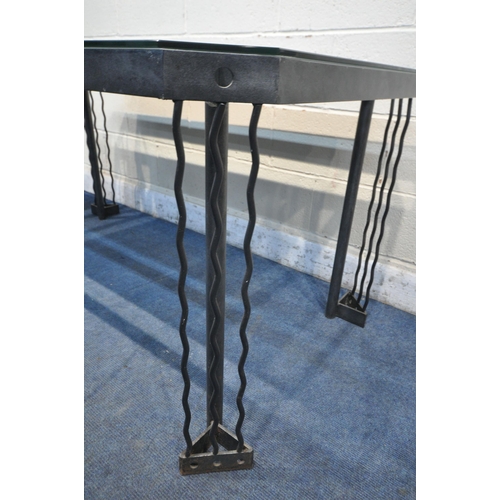 1296 - A METAL FRAMED RECTANGULAR GLASS TOP DINING TABLE, with canted corners and central coloured wood eff... 