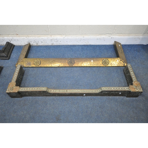 1308 - TWO WROUGHT IRON FENDERS, largest length 121cm x depth 29cm x height 27cm, along with a beaten brass... 