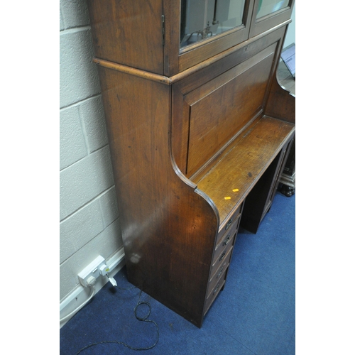 1311 - AN EARLY 20TH CENTURY WALNUT BUREAU BOOKCASE, the double bevelled glass doors enclosing an arrangeme... 