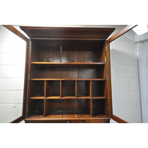 1311 - AN EARLY 20TH CENTURY WALNUT BUREAU BOOKCASE, the double bevelled glass doors enclosing an arrangeme... 