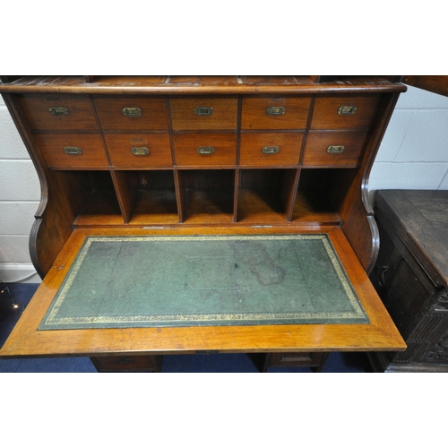 1311 - AN EARLY 20TH CENTURY WALNUT BUREAU BOOKCASE, the double bevelled glass doors enclosing an arrangeme... 