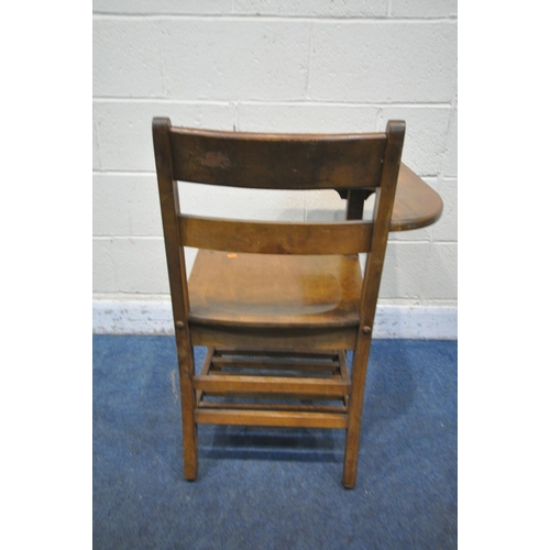 1313 - A 20TH CENTURY OAK SCHOOL CHAIR, with a right armrest which is also a desk, with slatted undershelf,... 