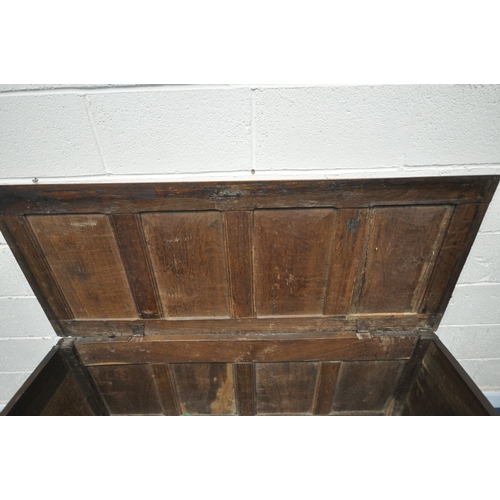 1319 - A GEORGIAN OAK PANELLED COFFER, with hinged lid, length 157cm x depth 63cm x height 71cm (condition ... 