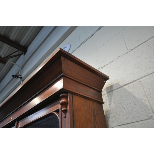 1325 - A 19TH CENTURY MAHOGANY BOOKCASE, with double glazed doors flanking a central glazed panel, enclosin... 