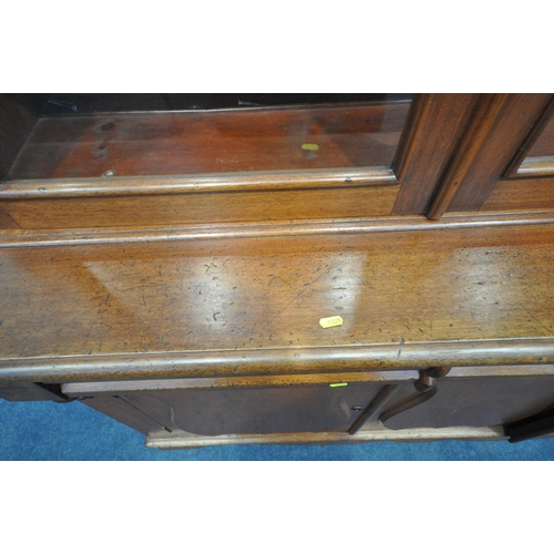 1325 - A 19TH CENTURY MAHOGANY BOOKCASE, with double glazed doors flanking a central glazed panel, enclosin... 