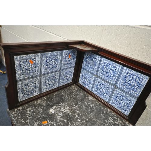 1328 - AN EARLY 20TH CENTURY MAHOGANY MARBLE TOP CORNER WASHSTAND, with tiled raised back and a single cupb... 