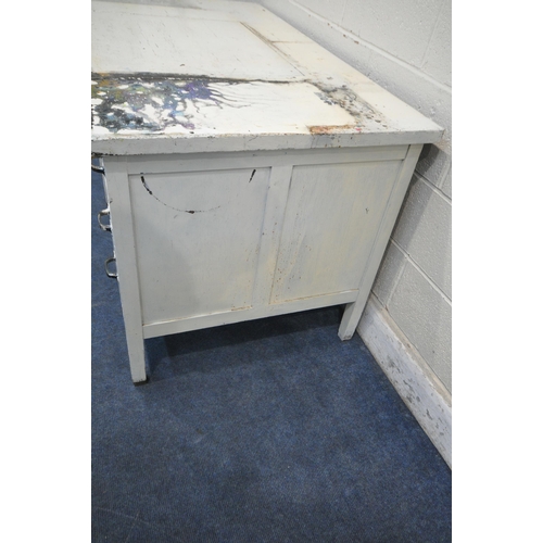 1337 - A WHITE PAINTED SECRETARY DESK, fitted with two brushing slides, six drawers, flanking an articulate... 