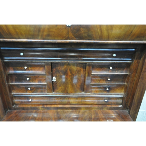 1340 - A 19TH CENTURY FLAME MAHOGANY ESCRITOIRE, with a stepped top, fitted with a single drawer, above a f... 