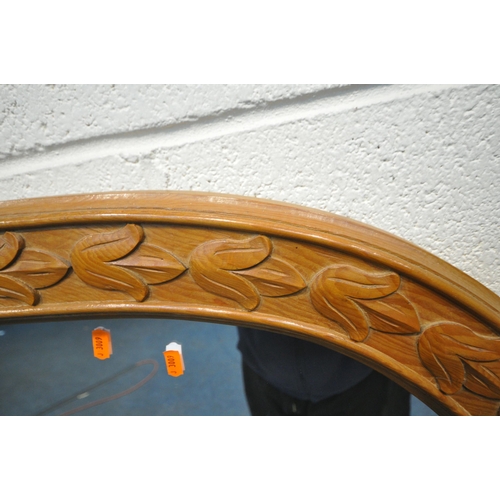 1344 - A PINE OVERMANTEL MIRROR, with a domed top and foliate decoration, width 130cm x height 90cm (condit... 