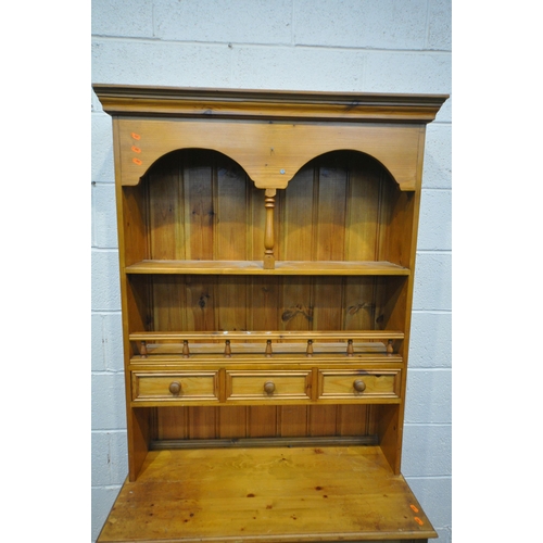 1345 - A 20TH CENTURY PINE DRESSER, the top fitted with two shelves and three drawers, the base with two dr... 