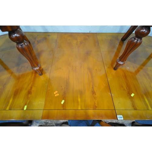 1350 - A YEWWOOD OVAL TWIN PEDESTAL DINING TABLE, with one additional leaf, extended length 213cm x closed ... 