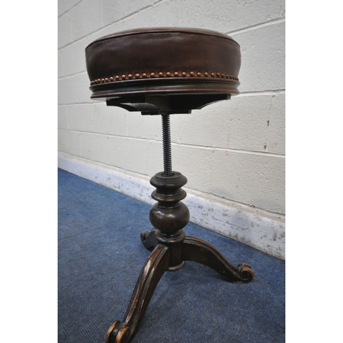 1357 - A VICTORIAN WALNUT PIANO STOOL, with brown leather studded upholstery, on a turned support and three... 