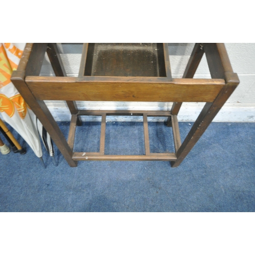 1365 - A 20TH CENTURY OAK UMBRELLA/STICK STAND, with a central hinged compartment, width 61cm x depth 31cm ... 