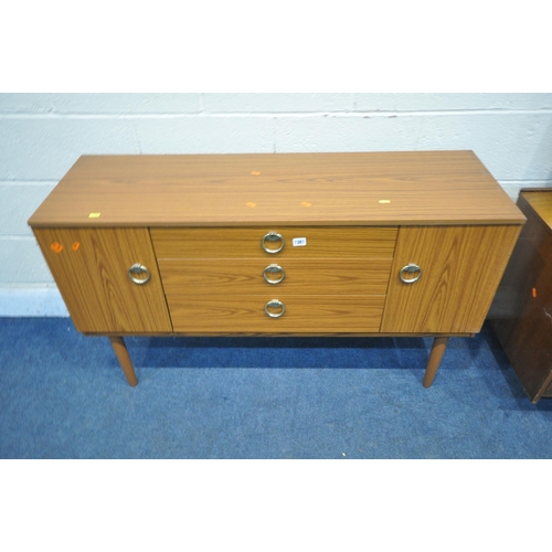 1381 - A MID CENTURY TEAK EFFECT SCHREIBER SIDEBOARD, with two cupboard doors, flanking there graduated dra... 