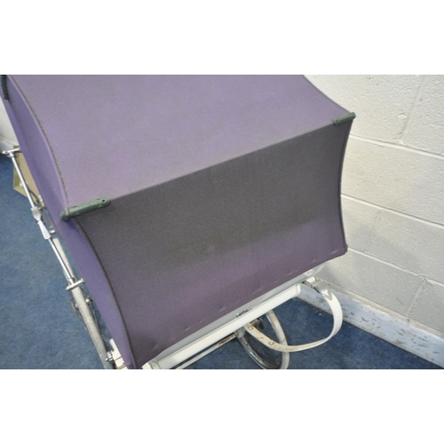 1383 - A VINTAGE WHITE WILSON PRAM, with purple cover and hood, along with a boxed green hood (condition re... 