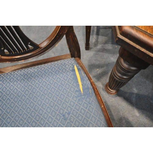 1389 - A 20TH CENTURY OAK WIND OUT DINING TABLE, with canted corners on turned legs, and an additional leaf... 