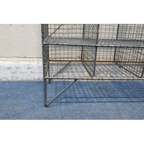 1396 - A WIRE MESH GYM LOCKER, with six tall sections and six small sections, on hair pin legs, width 138cm... 