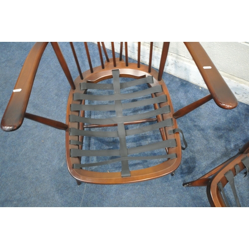 1398 - A PAIR OF DARK ERCOL SPINDLE BACK ARMCHAIRS, with open armrests, turned supports, legs and stretcher... 