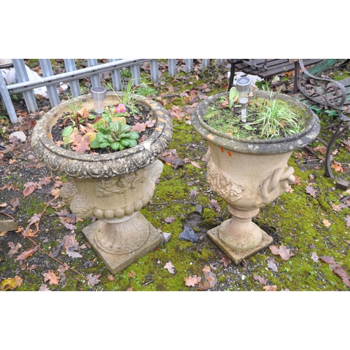 1012 - TWO COMPOSITE CAMPAGNA GARDEN URNS, one with twin mask effect handles height 85cm, the other with ro... 