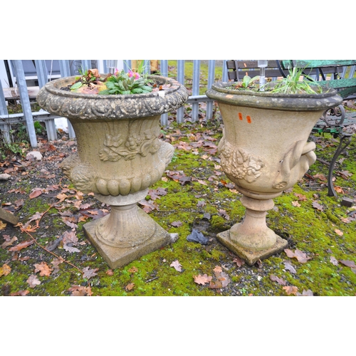 1012 - TWO COMPOSITE CAMPAGNA GARDEN URNS, one with twin mask effect handles height 85cm, the other with ro... 