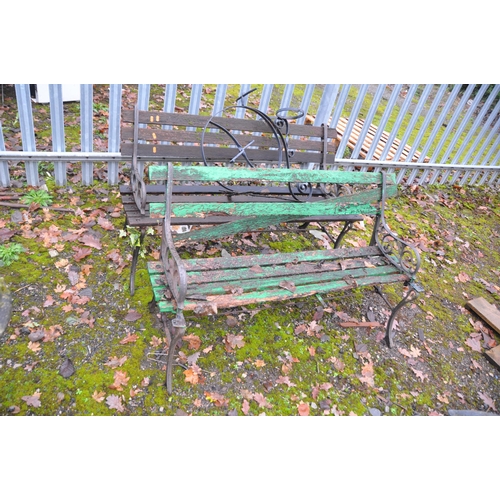 1013 - TWO MODERN WOODEN SLATTED GARDEN BENCHES with cast iron scrolled ends BOTH 122cm long, a modern ratt... 