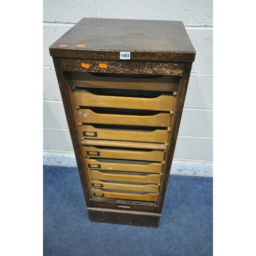 1403 - A 20TH CENTURY OAK TAMBOUR FRONT FILING CABINET, the door enclosing nine drawers, width 46cm x depth... 