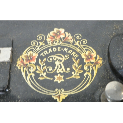 1410 - A FRISTER AND ROSSMAN WALNUT AND TUNBRIDGE WARE INLAID MANUAL SEWING MACHINE, on a cast iron Winselm... 