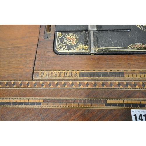 1410 - A FRISTER AND ROSSMAN WALNUT AND TUNBRIDGE WARE INLAID MANUAL SEWING MACHINE, on a cast iron Winselm... 