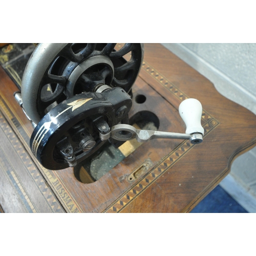 1410 - A FRISTER AND ROSSMAN WALNUT AND TUNBRIDGE WARE INLAID MANUAL SEWING MACHINE, on a cast iron Winselm... 