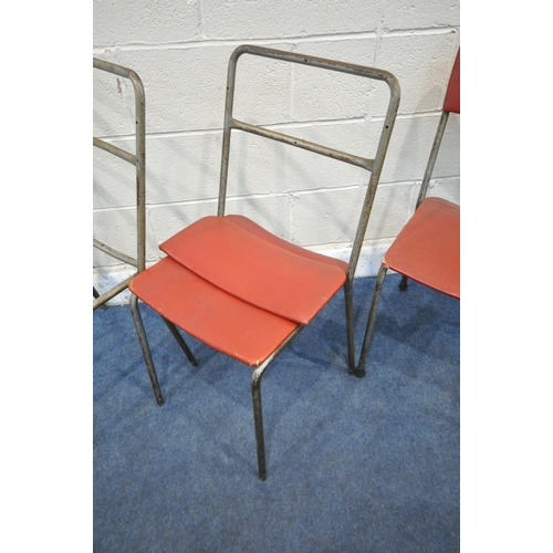 1413 - A SET OF SIX INDUSTRIAL TUBULAR METAL STACKING CHAIRS, with red leatherette upholstery, labelled Har... 