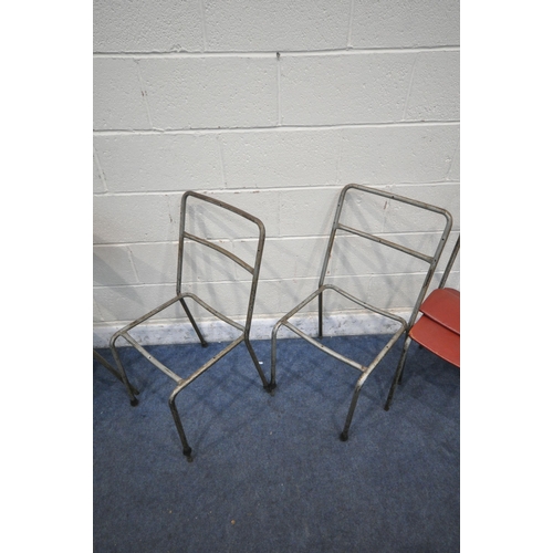 1413 - A SET OF SIX INDUSTRIAL TUBULAR METAL STACKING CHAIRS, with red leatherette upholstery, labelled Har... 