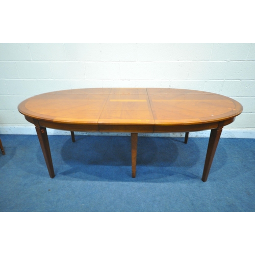 1419 - A REPRODUCTION CHERRYWOOD OVAL EXTENDING DINING TABLE, with one additional leaf, on six square taper... 