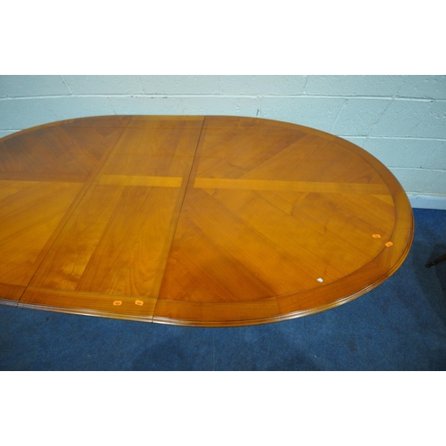 1419 - A REPRODUCTION CHERRYWOOD OVAL EXTENDING DINING TABLE, with one additional leaf, on six square taper... 