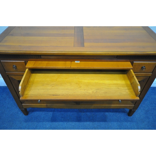 1420 - A REPRODUCTION CHERRYWOOD SIDEBOARD, fitted with a revolving pen tidy, two drawers flanking a centra... 