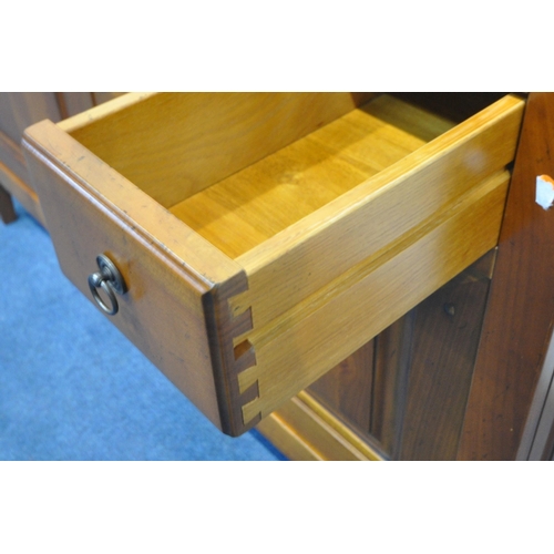 1420 - A REPRODUCTION CHERRYWOOD SIDEBOARD, fitted with a revolving pen tidy, two drawers flanking a centra... 