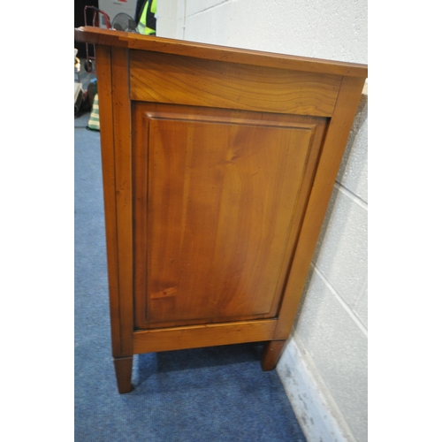 1420 - A REPRODUCTION CHERRYWOOD SIDEBOARD, fitted with a revolving pen tidy, two drawers flanking a centra... 