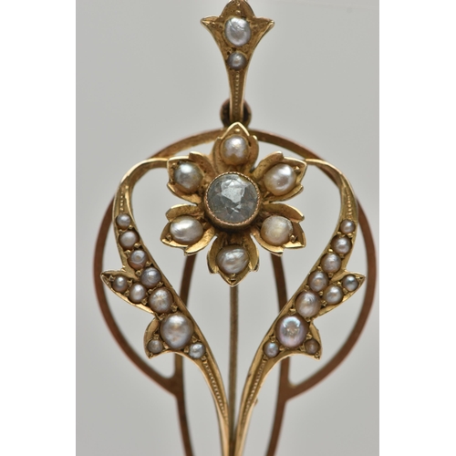 1 - AN EARLY 20TH CENTURY LAVALIER PENDANT, open work art nouveau pendant set with a circular cut aquama... 