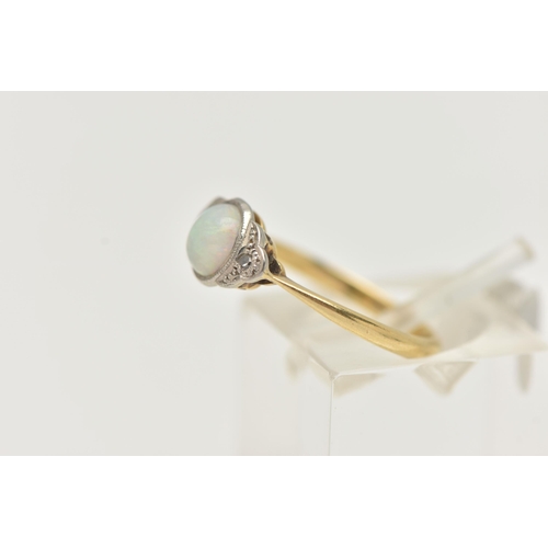 102 - A YELLOW METAL OPAL AND DIAMOND RING, set with a central oval opal cabochon, flanked with single cut... 