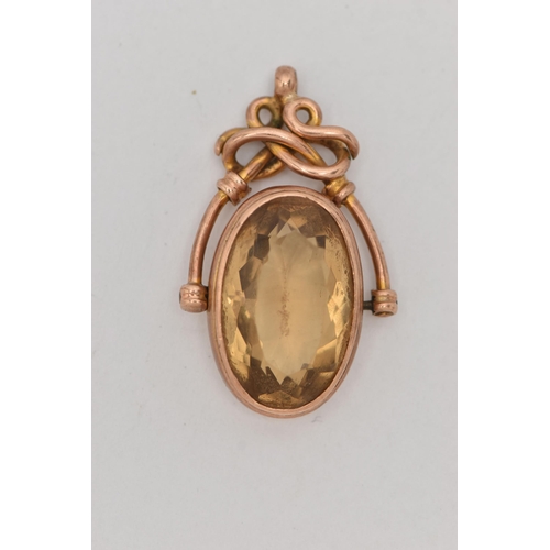 104 - A ROSE METAL CITRINE SWIVEL FOB, large oval cut citrine, collet set in a rose metal mount, stamped A... 