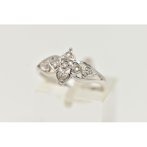 106 - A 9CT WHITE GOLD DIAMOND RING, floral open work design, set with single cut diamonds, open work shou... 