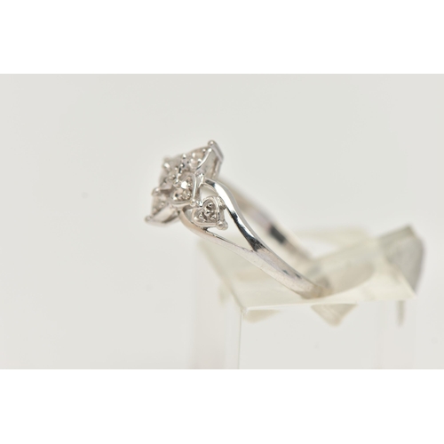 106 - A 9CT WHITE GOLD DIAMOND RING, floral open work design, set with single cut diamonds, open work shou... 