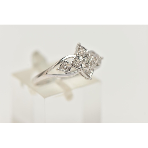106 - A 9CT WHITE GOLD DIAMOND RING, floral open work design, set with single cut diamonds, open work shou... 