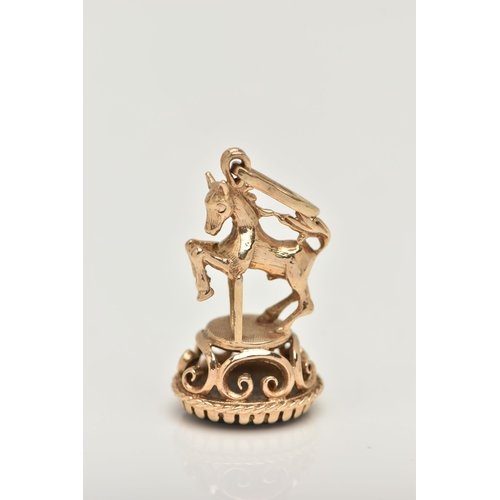 108 - A 9CT GOLD FOB SEAL, in the form of horse jumping a gate, hallmarked 9ct London, on a round base set... 