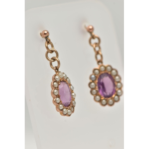 109 - A PAIR OF EARLY 20TH CENTURY AMETHYST AND SEED PEARL DROP EARRINGS, each earring of an oval form set... 
